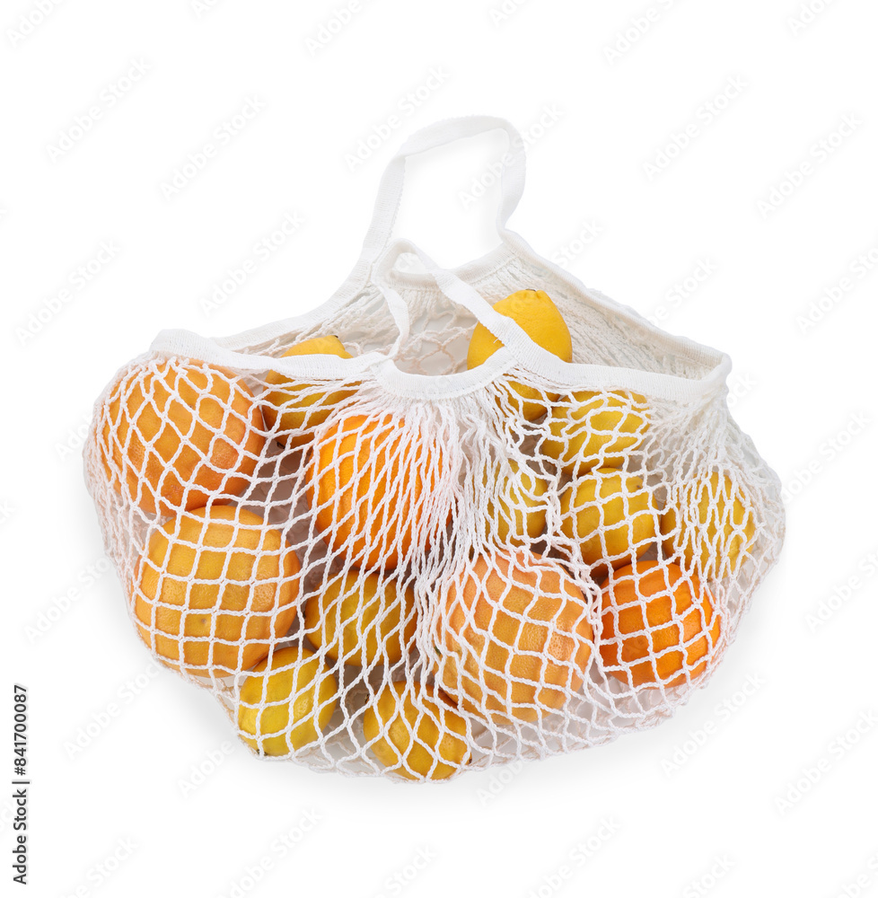 Fototapeta premium String bag with oranges and lemons isolated on white, top view