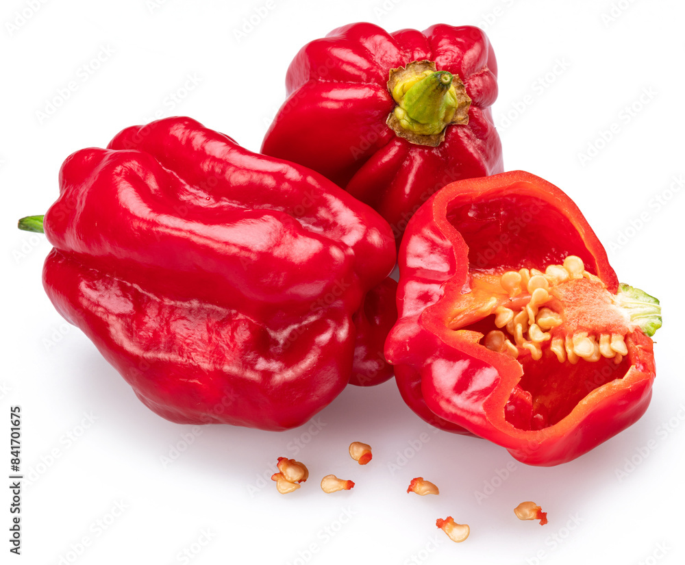 Red habaneros and sliced habanero pepper with seeds isolated on white background. Red habaneros and sliced habanero pepper with seeds isolated on white background.