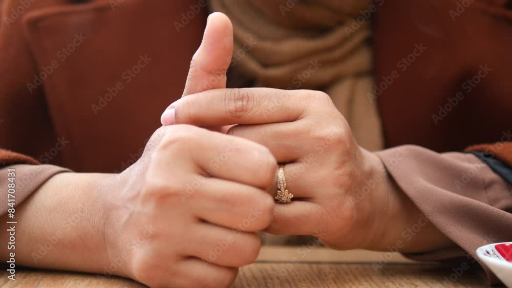Young women hands suffering thumb finger pain Young women hands suffering thumb finger pain