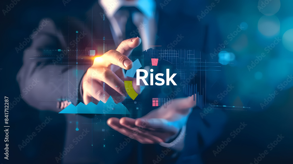 A businessman touching on the virtual screen with text Risk A businessman touching on the virtual screen with text Risk