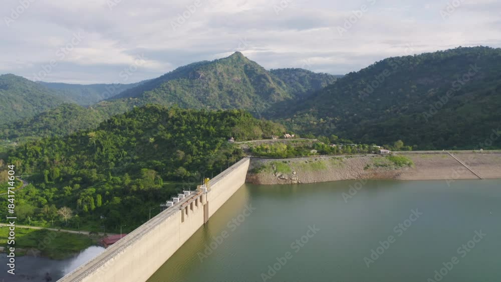 Aerial view of dam tower crane. Reservoir and sea water in recycle energy industry concept for electricity in Natural landscape background in Thailand. Environment. Aerial view of dam tower crane. Reservoir and sea water in recycle energy industry concept for electricity in Natural landscape background in Thailand. Environment.