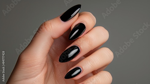 Merge simplicity and beauty: Sleek black nails with minimalist accents, embodying the epitome of modern sophistication