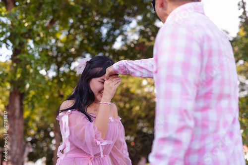 Cuadro en lienzo A young woman gives a mano po gesture as a sign of respect to her father