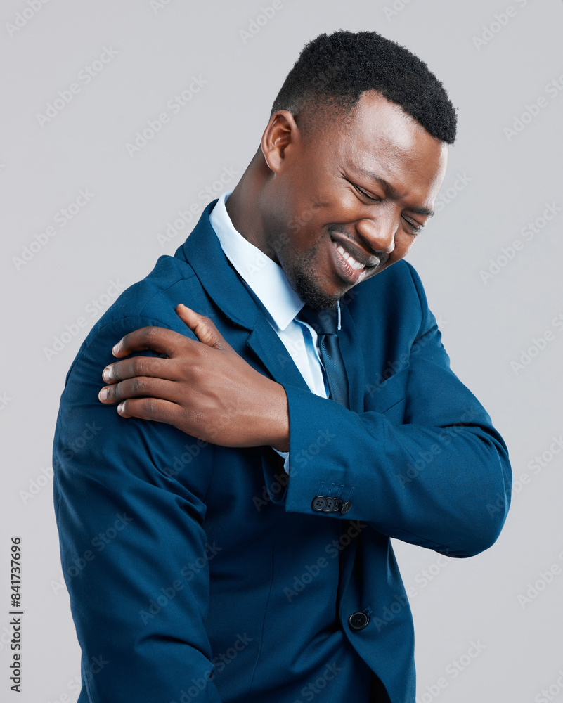 Shoulder pain, stress and businessman in studio with muscle problem, tension or burnout on grey background. Joint, inflammation and African male entrepreneur with anatomy crisis, wound or arm injury Shoulder pain, stress and businessman in studio with muscle problem, tension or burnout on grey background. Joint, inflammation and African male entrepreneur with anatomy crisis, wound or arm injury