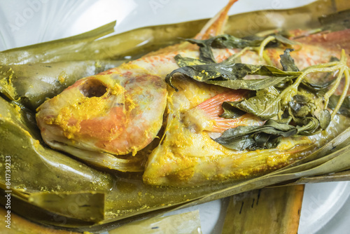 Foto Indonesian food: pepes ikan nila (steamed nile tilapia with spices)