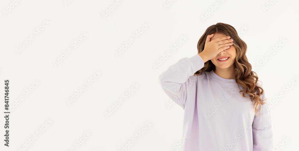Photo portrait woman closed eyes with hand laughing playing game isolated white color background Photo portrait woman closed eyes with hand laughing playing game isolated white color background
