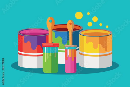 paint cans with bright splashes in the background, suggestive of painting or art. They are painted in blue, red and yellow, which are the primary colors. The painting brush is dipped into the jar.