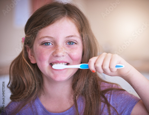 Dental, smile and portrait of child brushing teeth for oral hygiene, cavity prevention and gum care. Happy, little girl and hand with toothbrush for morning routine, cleaning and healthy growth
