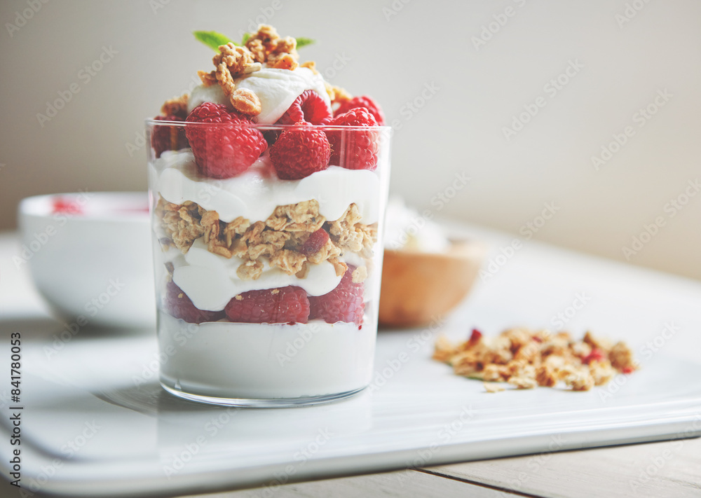 Breakfast, cereal and yogurt with raspberry on plate for vegan food, health and protein in morning. Vitamins, glass and dairy in clear container with fruit for organic nutrition, weight loss and diet Breakfast, cereal and yogurt with raspberry on plate for vegan food, health and protein in morning. Vitamins, glass and dairy in clear container with fruit for organic nutrition, weight loss and diet