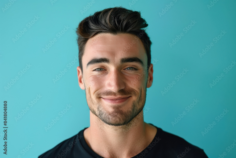 A close up portrait of a young man with a subtle smile A close up portrait of a young man with a subtle smile