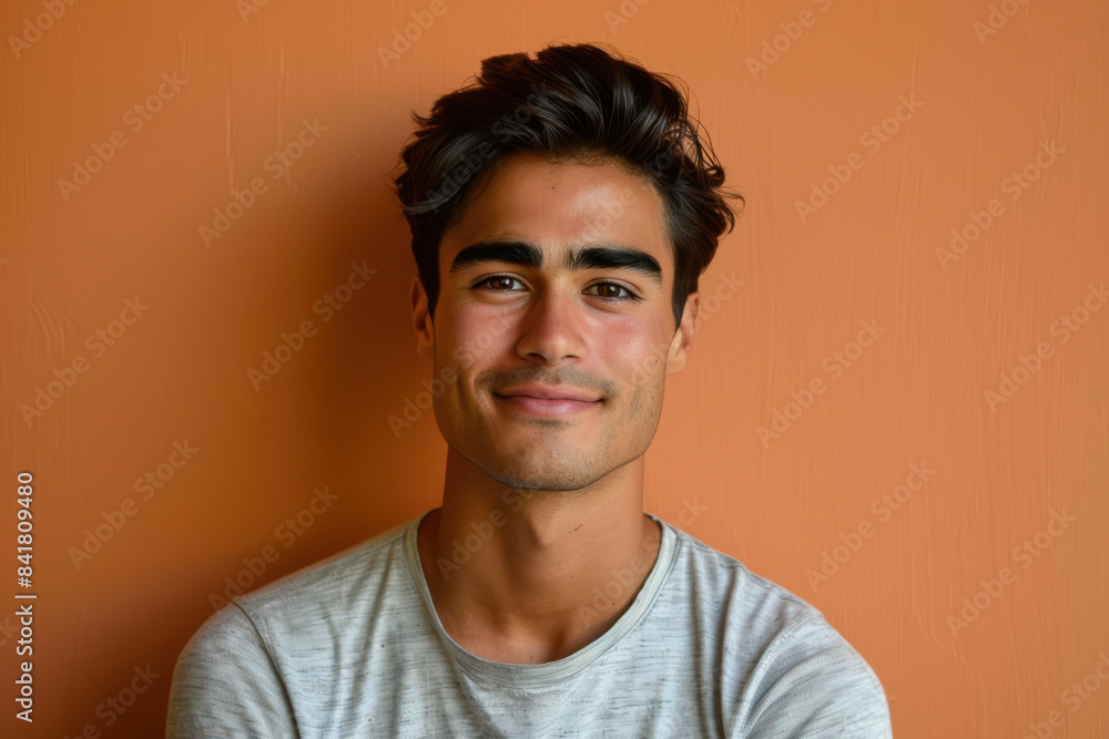 Fototapeta premium A close up portrait of a young man with a subtle smile