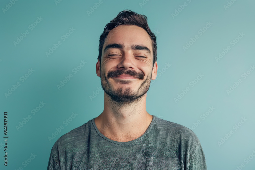 A close up portrait of a young man with a subtle smile A close up portrait of a young man with a subtle smile