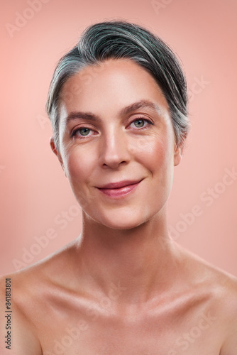 Beauty portrait  anti aging and senior woman with facial glow and natural makeup in studio. Skin health  dermatology and mature lady with collagen skincare and luxury spa aesthetic by pink background