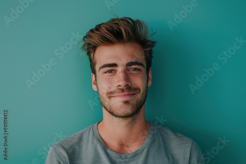 A close up portrait of a young man with a subtle smile © MagnusCort