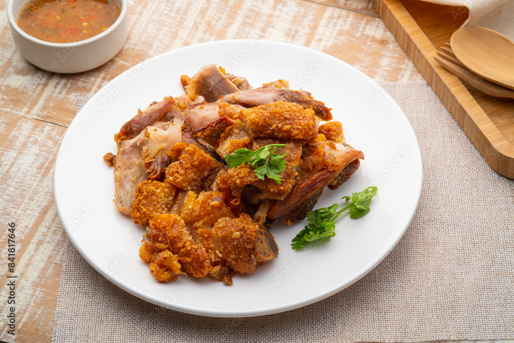 Deep Fried Pork Knuckle,Sliced crispy pork in white plate Deep Fried Pork Knuckle,Sliced crispy pork in white plate