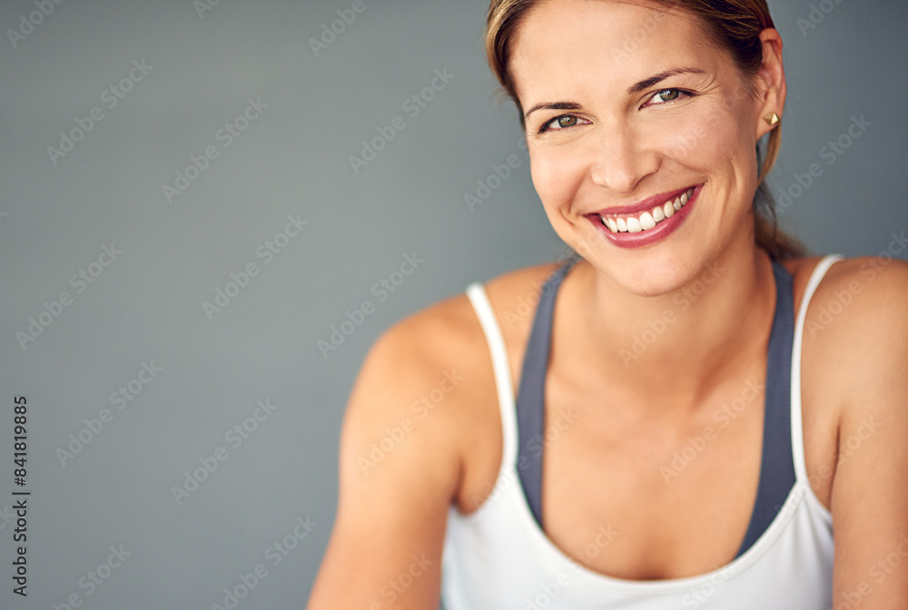 Portrait, smile and woman with exercise, wellness and healthy person on grey studio background. Face, model and athlete with balance, mockup space and challenge with training, progress and fitness Portrait, smile and woman with exercise, wellness and healthy person on grey studio background. Face, model and athlete with balance, mockup space and challenge with training, progress and fitness