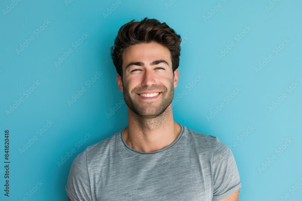 A close up portrait of a young man with a subtle smile A close up portrait of a young man with a subtle smile