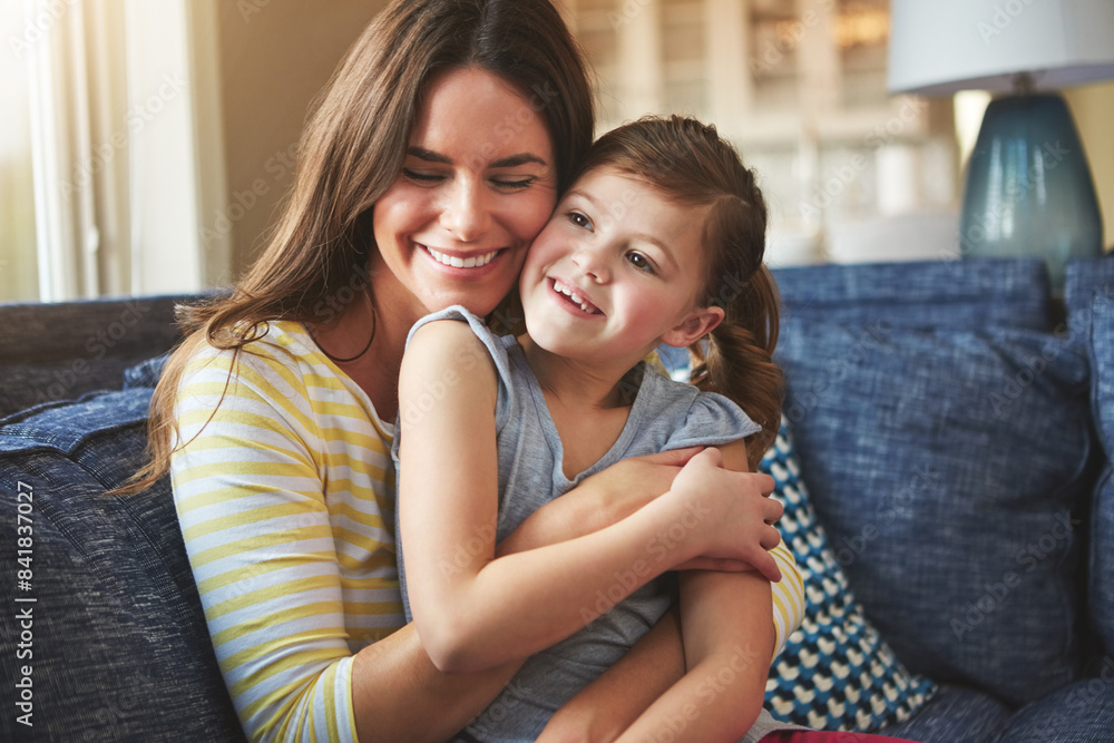 Fototapeta premium Hug, mother or child love on sofa home for trust, bonding and support of relationship memory. Smile, woman and girl as family for care, security or relax with embrace on couch for development