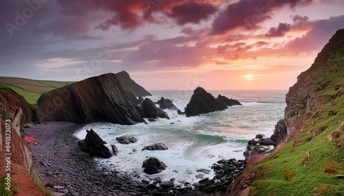 stunning landscape image of view from hartland quay in devon england durinbg moody spring sunset photo