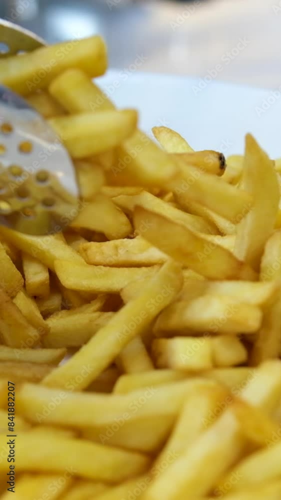 pick up french fries buffet picks up a frozen shred and puts it in a shopping cart. selection of frozen french fries close up pick up french fries buffet picks up a frozen shred and puts it in a shopping cart. selection of frozen french fries close up