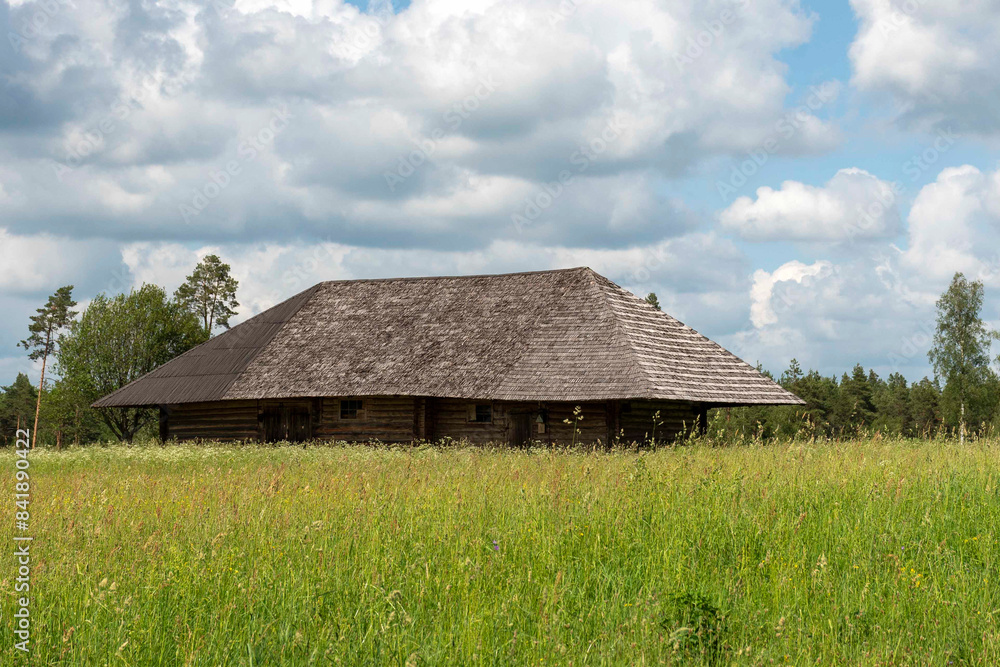 Fototapeta premium rural landscape with beautiful clouds and old wooden barn,