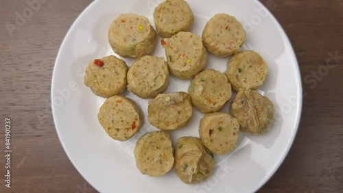 a dish of chicken rolls