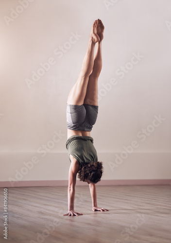 Photos Woman, handstand and yoga exercise in fitness studio of space, body and wellness for health