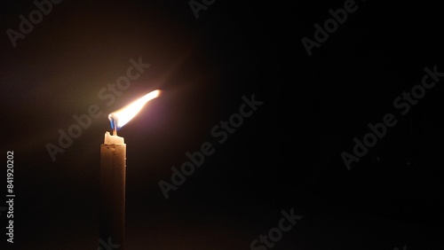 candle in the dark with copy space area 