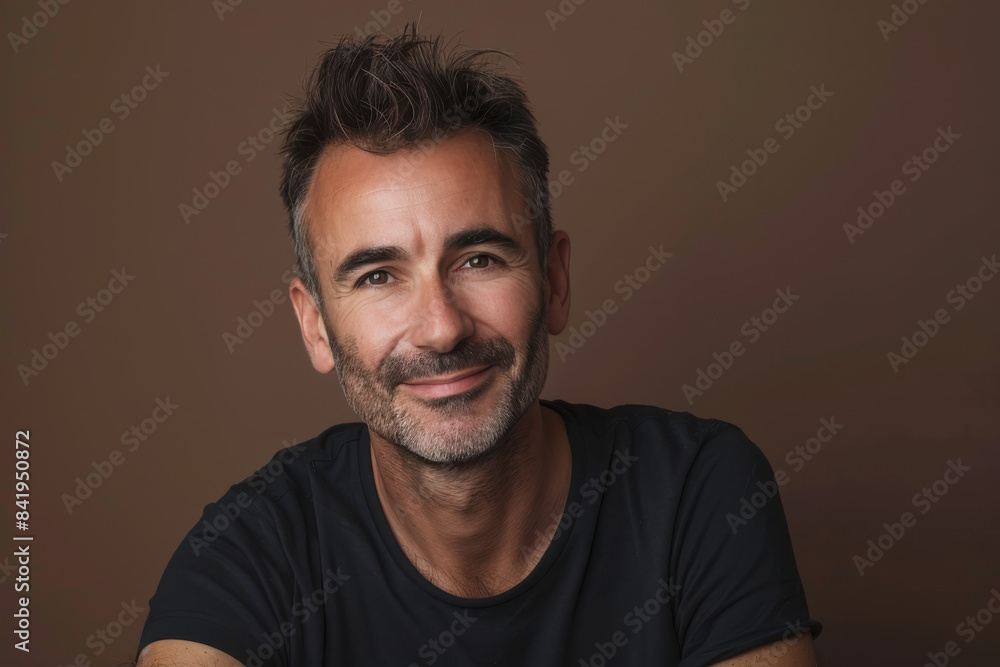 Obraz premium A close up portrait of a young man with a subtle smile