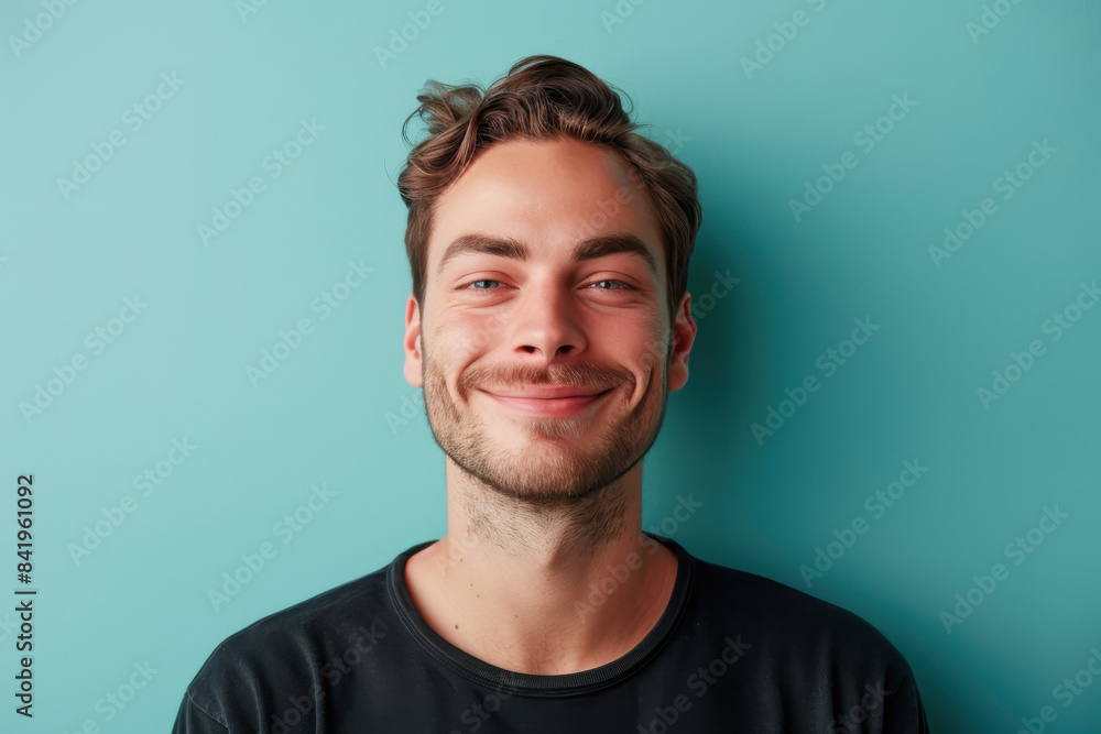 A close up portrait of a young man with a subtle smile A close up portrait of a young man with a subtle smile