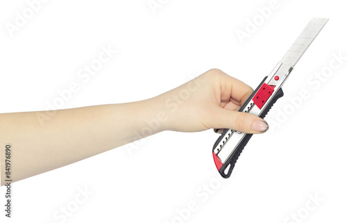 stationery or construction knife in hand, outstretched hand with stationery or construction knife isolated from background