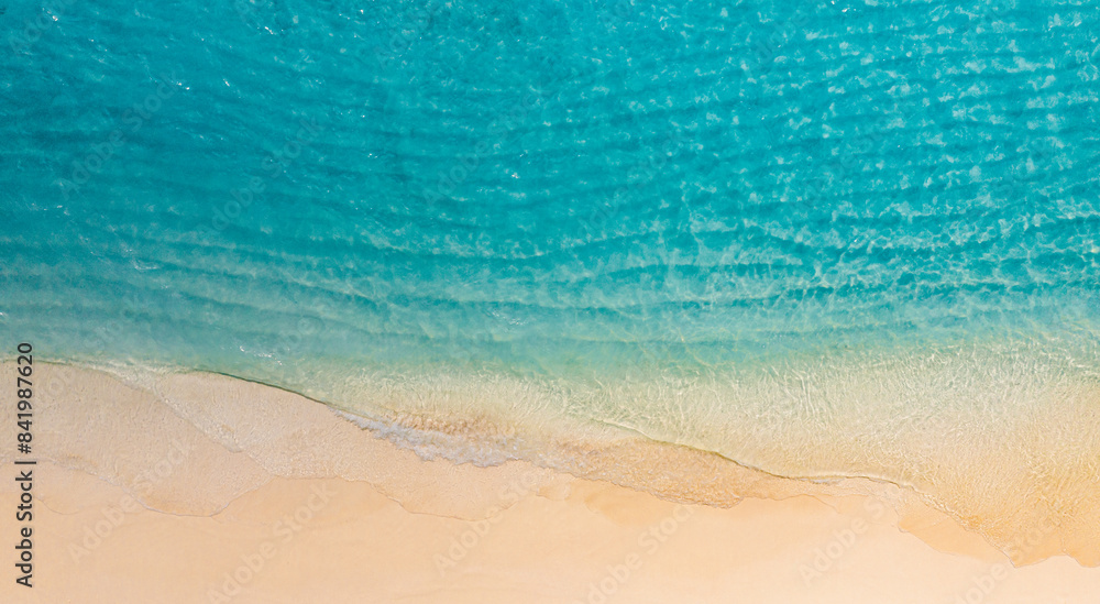 Obraz premium Relaxing aerial beach scene, summer vacation holiday template banner. Waves surf with amazing blue ocean lagoon, sea shore, coastline. Perfect aerial drone top view. Peaceful bright beach, seaside