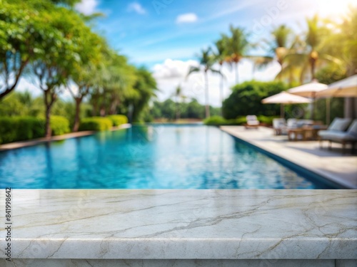 Empty white marble table with blurry swimming pool in the background  perfect for copy space  white  marble  table  empty  blurry  swimming pool  background  copy space  elegant  luxurious