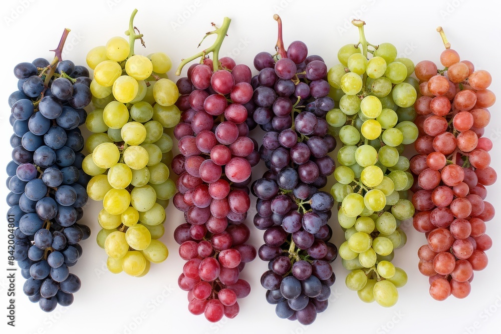 Set of grapes of different varieties and colors on a white background.