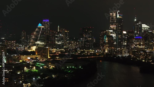 Wallpaper Mural Dynamic Austin skyline at night from a stunning aerial view, capturing the glowing buildings and the sparkling river below. Urban and cityscape concepts Torontodigital.ca