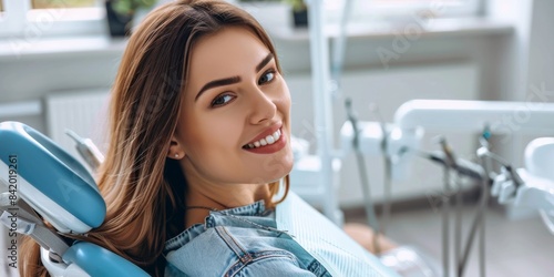 Focus a happy Woman Area injury Toe and smile look at camera sitting on dentist chair  photo