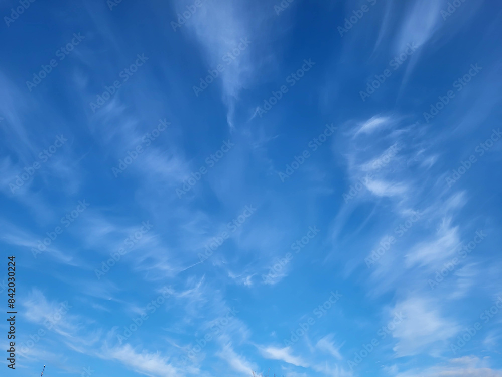 Beautiful blue sky and feathery white clouds nice bright day Beautiful blue sky and feathery white clouds nice bright day