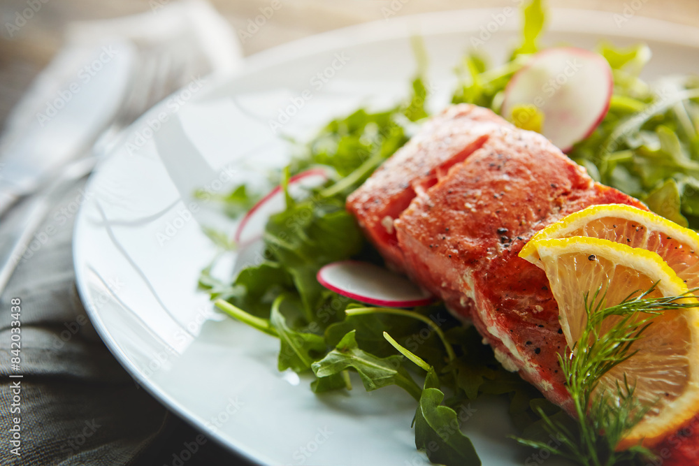 Food plate, fish protein and salad for health with nutrition, lunch and wellness with pescatarian diet. Salmon, rocket leaves and dinner on table with cholesterol for vitamin c benefits and digestion Food plate, fish protein and salad for health with nutrition, lunch and wellness with pescatarian diet. Salmon, rocket leaves and dinner on table with cholesterol for vitamin c benefits and digestion