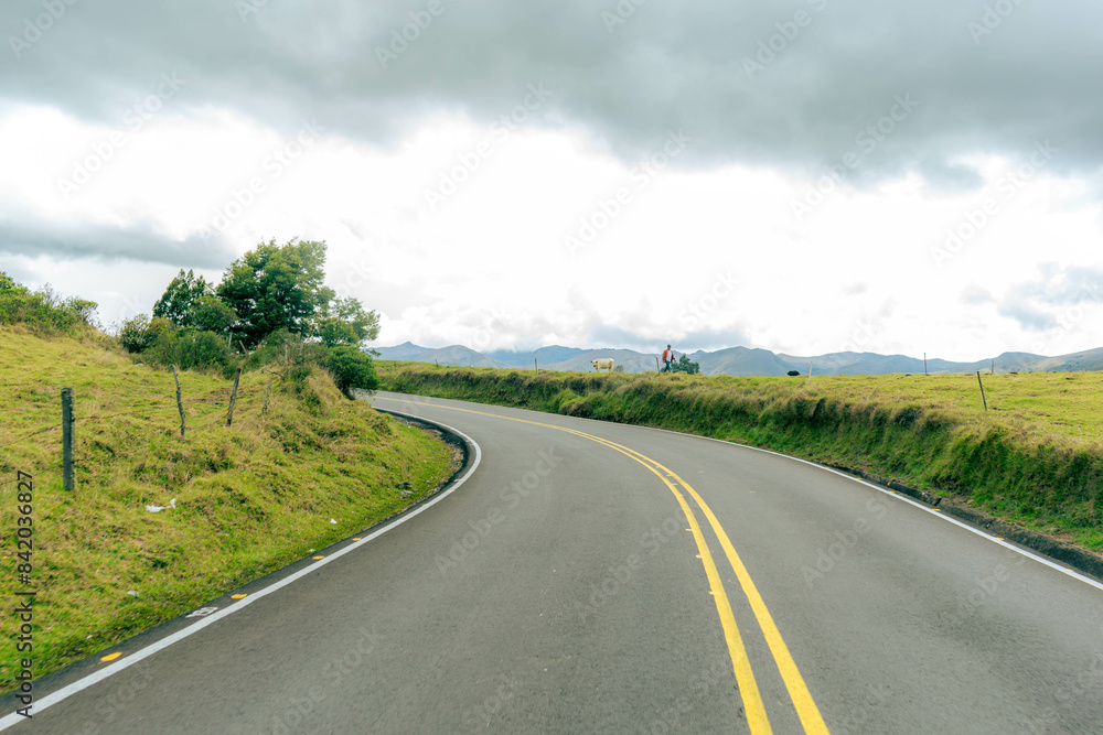 mountainous landscape with a road that disappears into the horizon mountainous landscape with a road that disappears into the horizon