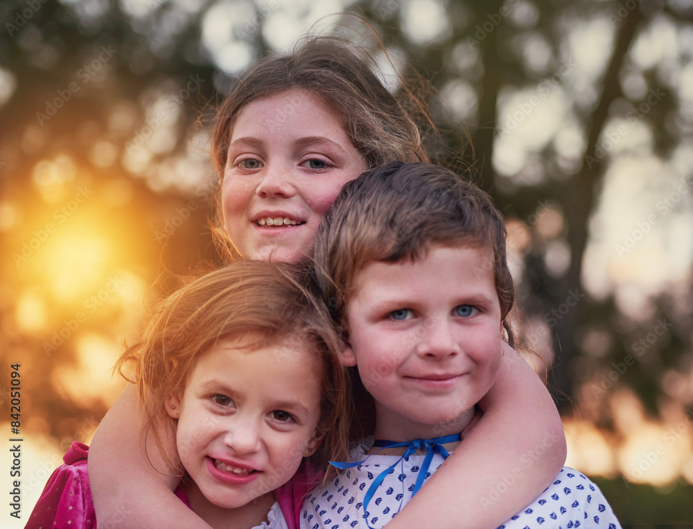 Kids, portrait and siblings hug in a garden with love, trust and bonding on vacation at sunset. Happy, face and children in a backyard with costume for games, fun and Halloween in the neighborhood Kids, portrait and siblings hug in a garden with love, trust and bonding on vacation at sunset. Happy, face and children in a backyard with costume for games, fun and Halloween in the neighborhood