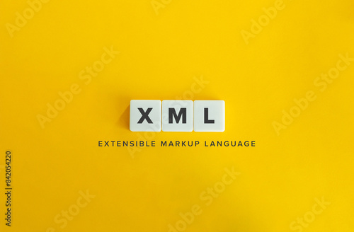 XML, or Extensible Markup Language Term and Banner. Text on Block Letter Tiles on Flat Background. Minimalist Aesthetics. photo