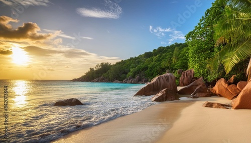 sunset at tropical beach anse lazio on praslin on the seychelles