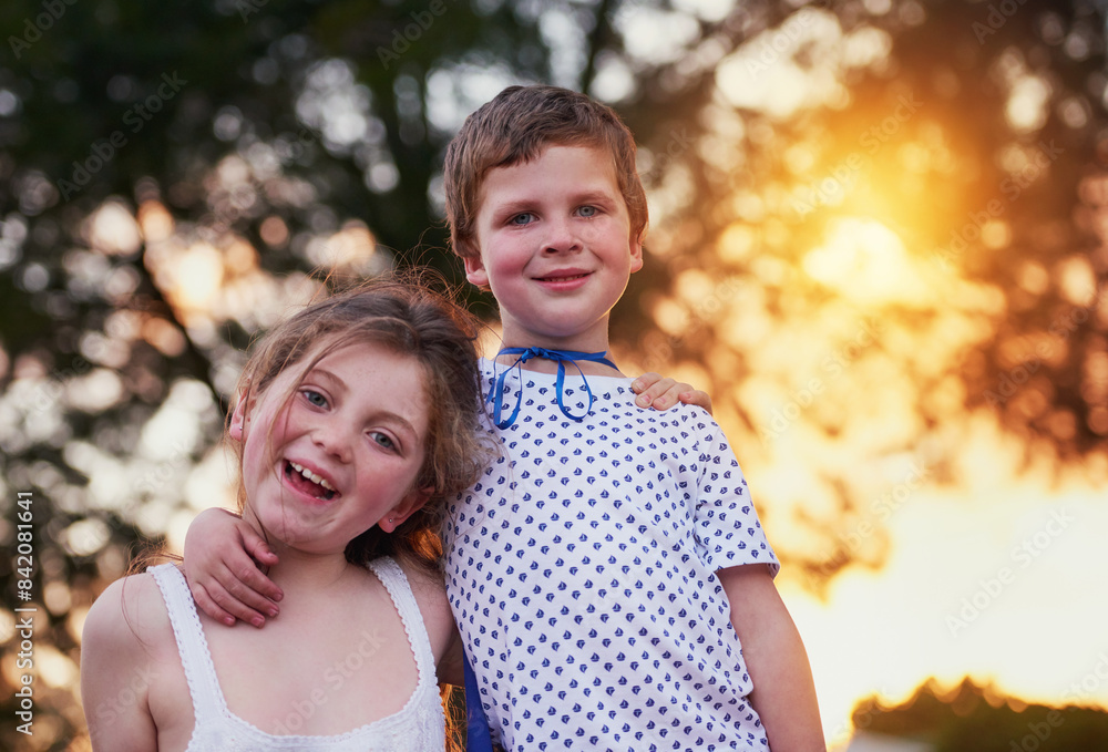 Children, portrait and siblings hug in a garden with love, trust and bonding on vacation at sunset. Happy, face and girl with boy in a backyard with costume for games, fun and neighborhood Halloween Children, portrait and siblings hug in a garden with love, trust and bonding on vacation at sunset. Happy, face and girl with boy in a backyard with costume for games, fun and neighborhood Halloween