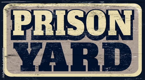 Aged and worn prison yard sign on wood