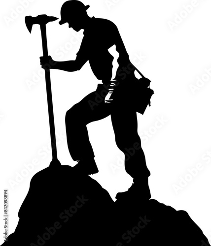 Silhouette of Climber on Mountain Top Representing Achievement
