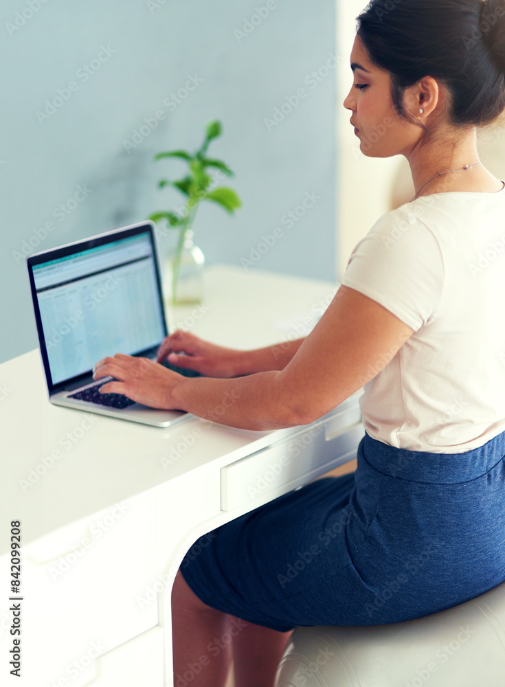Naklejka premium Woman, laptop and typing in home office for proposal, planning and yoga ball for posture. Female person, profile and professional for project management, online and web for research or copywriting