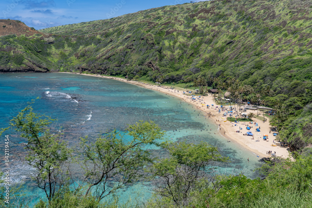 Hanauma bay is a marine embayment formed within a tuff ring and located along the southeast coast of the Island of Oʻahu in the Hawaii Kai neighborhood of East Honolulu, in the Hawaiian Islands. 