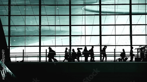 People walking with luggage in airport