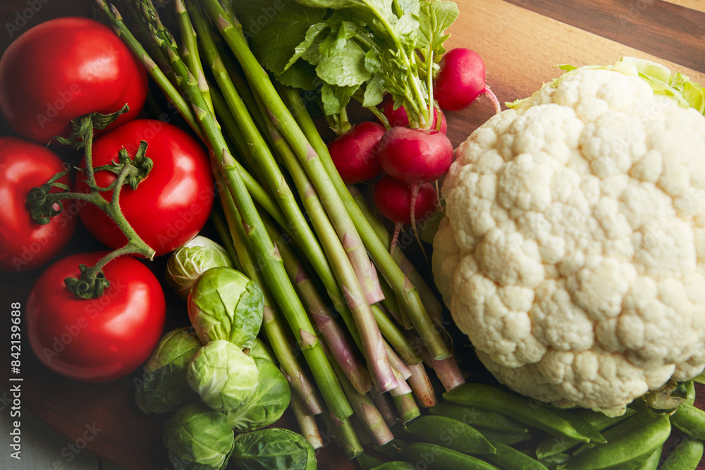 Food, table and vegetable on cutting board for cooking with diet, nutrition and healthy living. Fresh, crops and closeup with organic or vegetarian meal for wellness, wellbeing and self care Food, table and vegetable on cutting board for cooking with diet, nutrition and healthy living. Fresh, crops and closeup with organic or vegetarian meal for wellness, wellbeing and self care