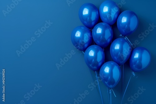 Dark blue balloons on a blue background, with space for text